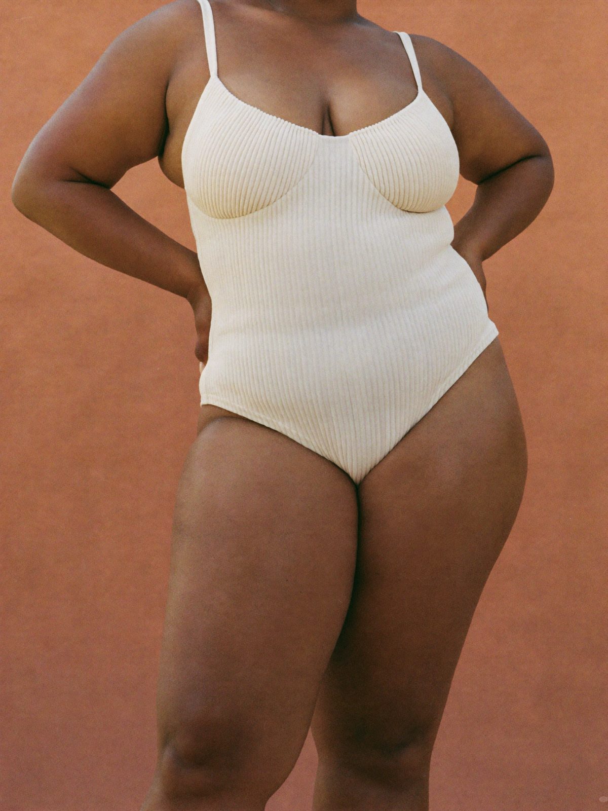 The Starlet ribbed ivory one-piece on a curvy model